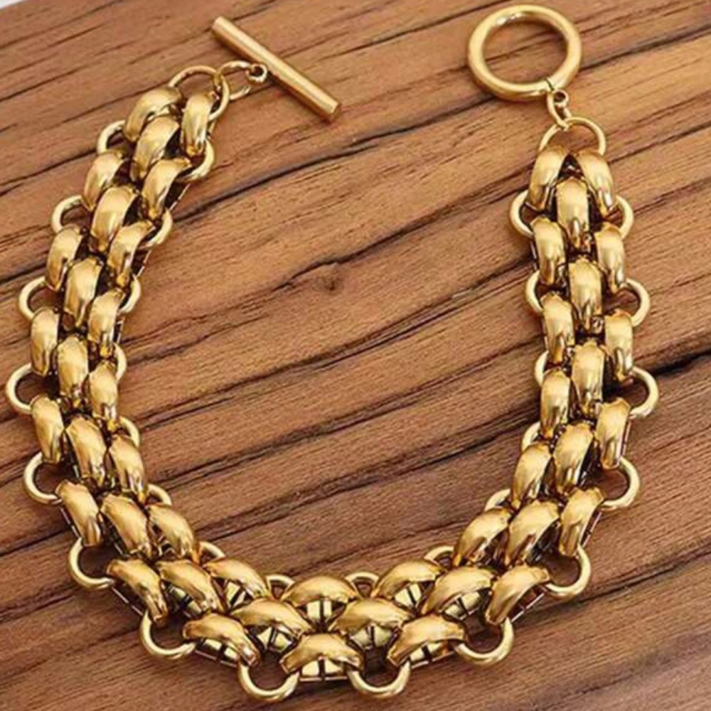 Gold tone chunky bracelet.